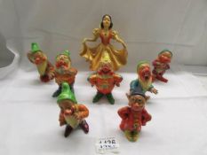 A 1930's Wade set of Snow White and the Seven Dwarfs designed by Jessie Van Hallen.