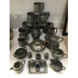 A mixed selection of pewter ware including tankards