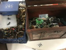 A chest of costume jewellery and a crate of costume jewellery