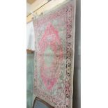 A pink patterned rug.