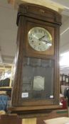 An oak wall clock.