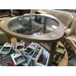 An oak coffee table with glass insert