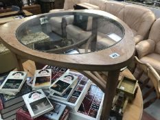 An oak coffee table with glass insert