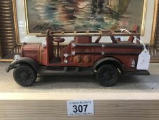 A cast iron reproduction fire engine.