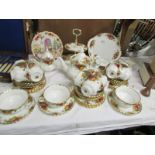 48 pieces of Royal Albert Old Country Roses tea ware and a Christmas plate.
