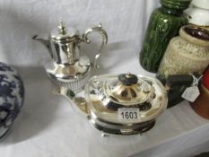 A silver plated teapot and coffee pot.