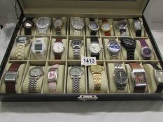 A case of 24 wristwatches.