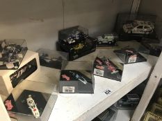 A quantity of boxed Formula motor sport rally cars by Minichamps, Quartzo etc.