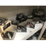 A quantity of boxed Formula motor sport rally cars by Minichamps, Quartzo etc.