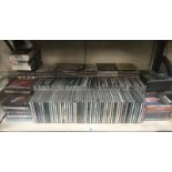 A collection of CD's with some cassette tapes