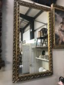 A gilt framed mirror