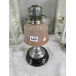 An early 20th century oil lamp base with chrome burner.