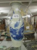 An oriental blue and white vase.