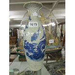 An oriental blue and white vase.