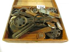A quantity of old tools for removing the backs from watches.