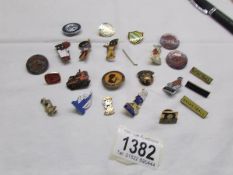 A collection of badges including 3 Robinson's Golly badges.