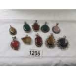 10 assorted stone set silver pendants including carnelian, rose quartz, tigers' eye etc.