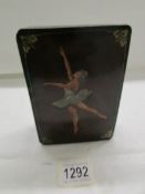 A lacquered box depicting a ballerina.