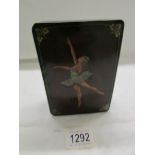 A lacquered box depicting a ballerina.