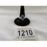 A 14ct white gold ring set tanzanite and pava diamonds, marked 14k and CJ. Size S half.