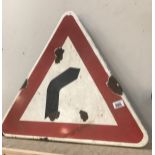 A vintage enamel warning triangle road sign 'bend in road'
