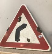 A vintage enamel warning triangle road sign 'bend in road'