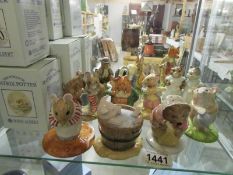12 boxed Beatrix Potter figurines including Royal Doulton,