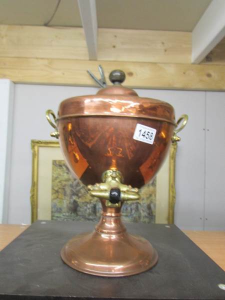 A copper samovar urn with brass tap.