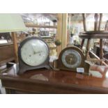 A Smith's mantel clock and an Ingersol mantel clock.