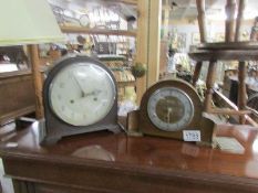 A Smith's mantel clock and an Ingersol mantel clock.