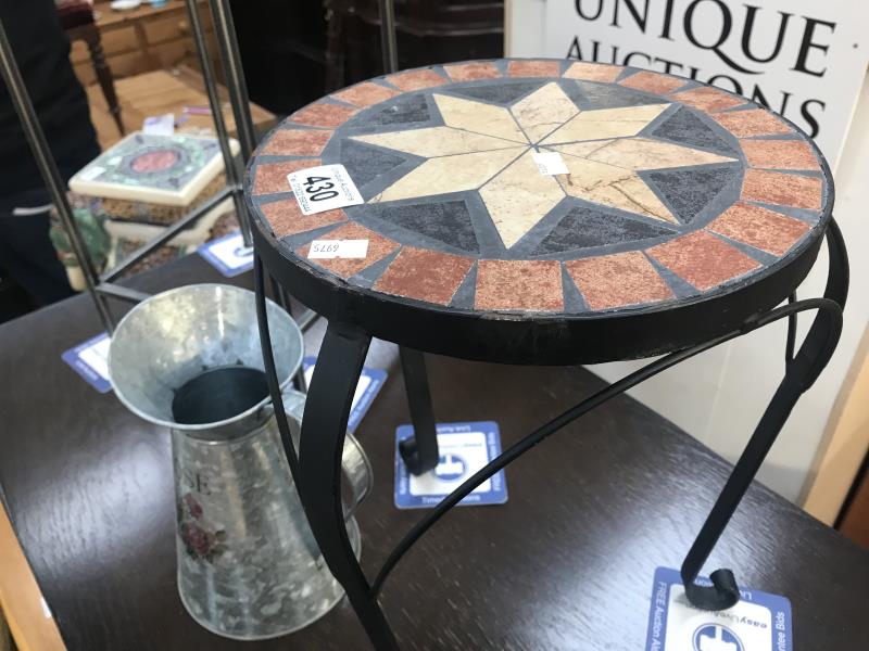 A wrought iron plant stand with mosaic top and 1 other and a galvanised jug - Image 2 of 3