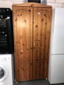 A pine 2 door wardrobe