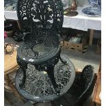 A painted metal garden table and 2 chairs