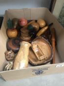 A box of wooden items including fruit