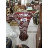 A cut glass ruby overlaid vase.