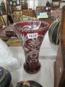 A cut glass ruby overlaid vase.