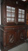 An old French dresser having 2 glazed doors to top and 2 doors,