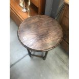 A 1930's oak side table with barley twist legs