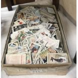 A box of approximately 2000 assorted cigarette cards manufacturers including Wills, Platers,