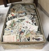 A box of approximately 2000 assorted cigarette cards manufacturers including Wills, Platers,