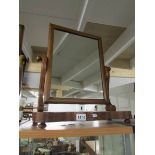 A Victorian mahogany toilet mirror.