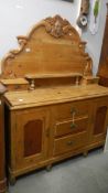 A Lincolnshire pine dresser with carved back.