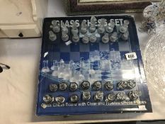 A glass chess set and board