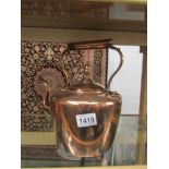 A Victorian copper kettle.