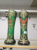 A pair of 19th century green glass hand painted vases with red and gold.