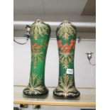 A pair of 19th century green glass hand painted vases with red and gold.