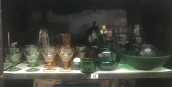 A shelf of drinking glasses,