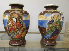 A pair of hand painted Satsuma vases.