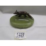 A cold cast bronze fox surmounted on an onyx ashtray.