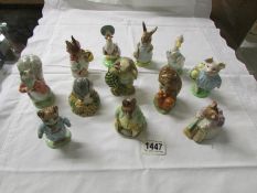 12 boxed John Beswick Beatrix Potter figurines.